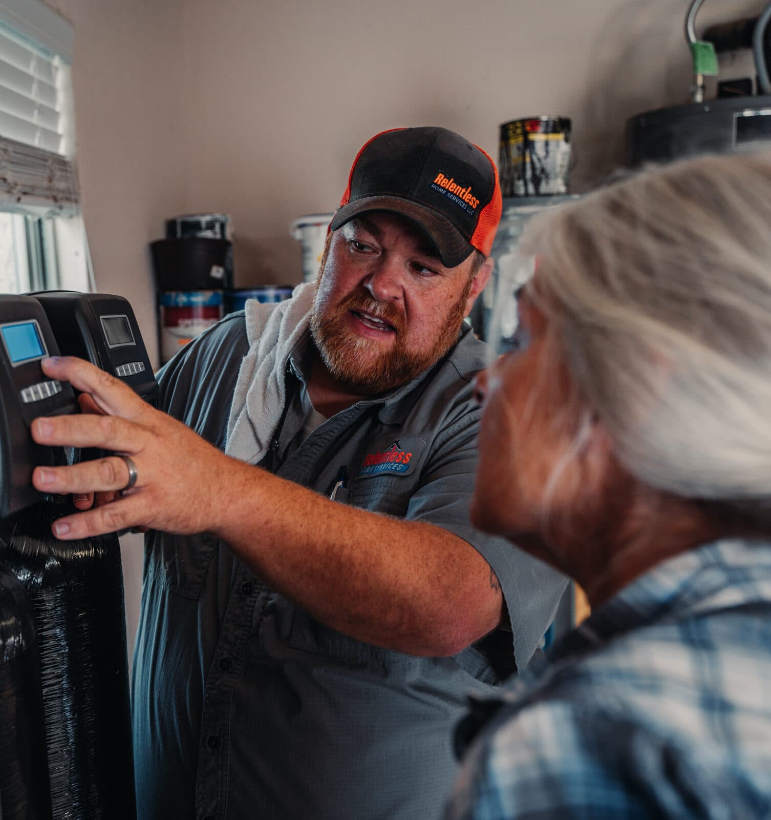 Relentless Home Services technician installing water filtration system